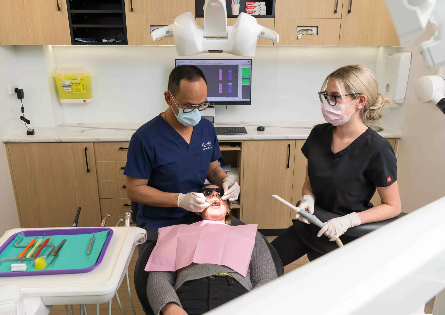 Gentle Dental staff conducting dental exam
